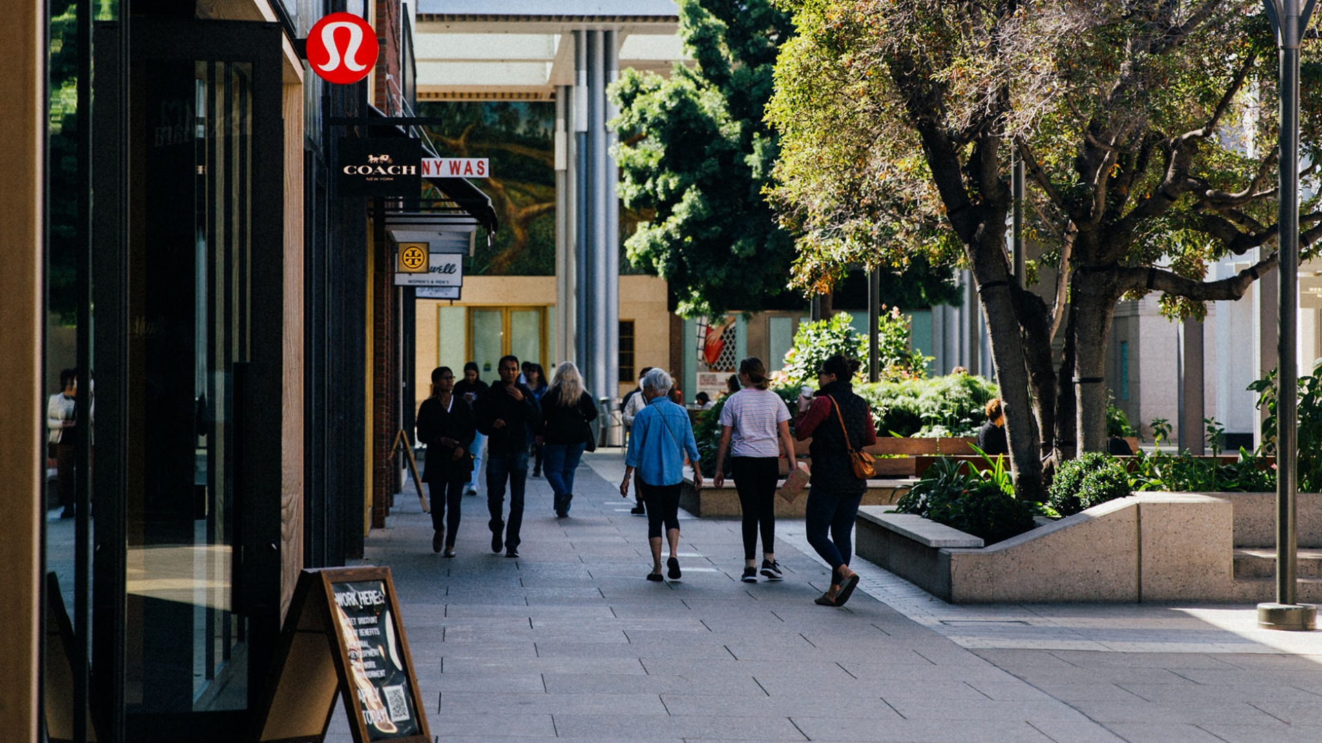 people walking and shopping